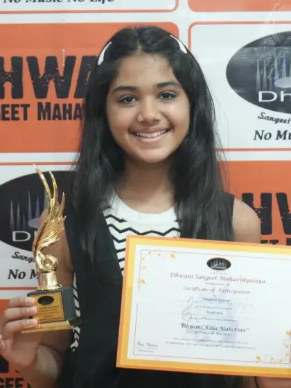 A beaming student holds her trophy and certificate. These moments of pride are what make the journey of learning music so rewarding.