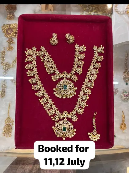 This beautiful uncut stone (kundan) set with green stones has been booked. It's a popular choice for engagements and sangeet ceremonies.