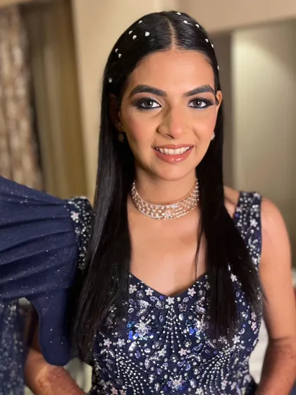 The final look is bold and beautiful, with pearl hair accessories adding a touch of modern chic.