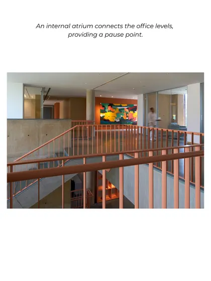 An internal atrium at the JSW Vijayanagar office provides a pause point and connects different levels. The use of natural light and a vibrant piece of art creates an inviting atmosphere for informal interactions.
