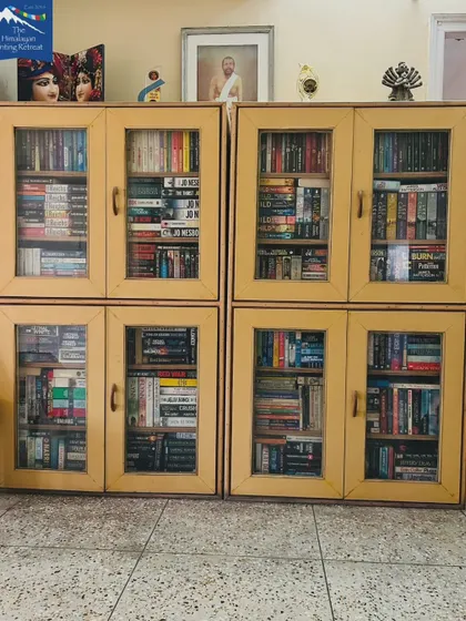 Our library is the heart of the retreat. These glass-doored cabinets house a diverse collection of fiction and non-fiction, waiting to be explored by our guests.