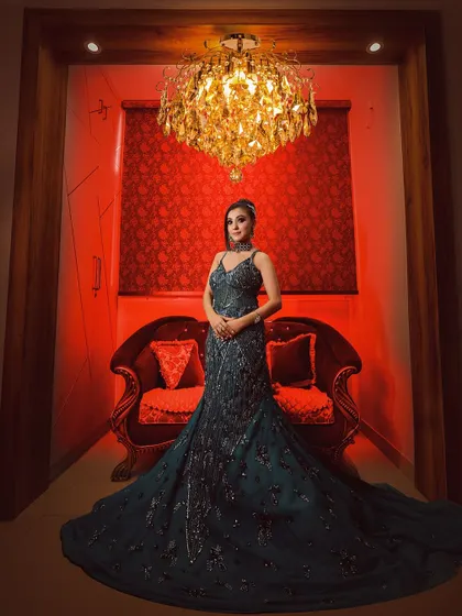 This is an example of a full-length creative portrait in my Noida studio. The dramatic red lighting and elegant pose create a powerful, magazine-worthy image.