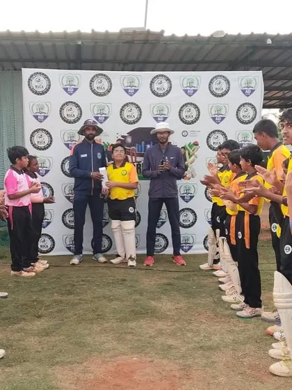 A player receives a guard of honor from both teams as he walks up to collect his award.