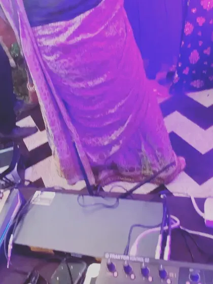 A view from the DJ booth, with guests in beautiful sarees dancing right up to the console.
