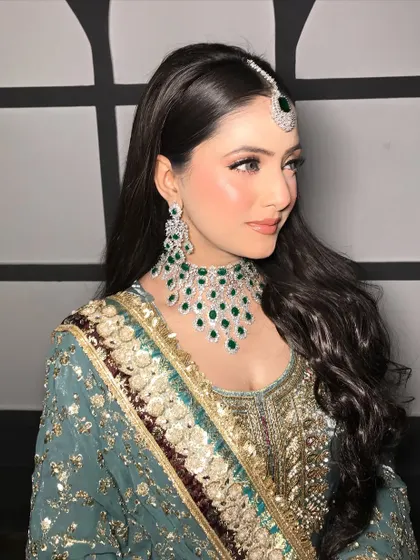 A side profile highlighting the elegant contour and shimmering highlighter.