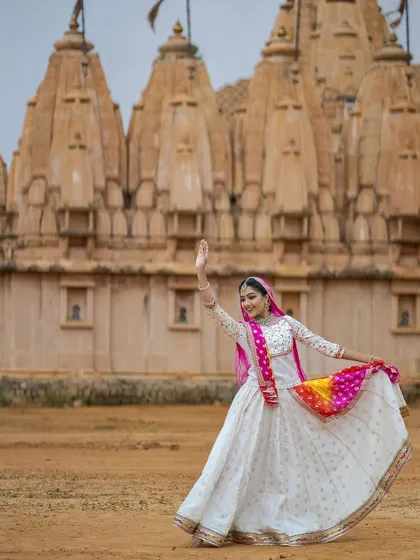A solo portrait from our temple photoshoot. The traditional setting feels like the perfect home for our classical art form, connecting us to generations of dancers before us.