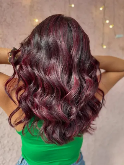 The back view of this beautiful red balayage. The color is so rich and dimensional. (No filter)