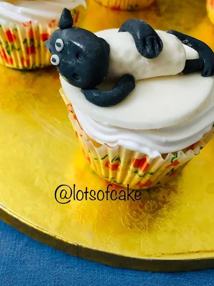 A close-up of one of my favourite Bakrid cupcakes, featuring a cute, sleepy sheep made from fondant.