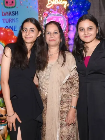 Guests posing for a photo at the Cocomelon-themed birthday party.
