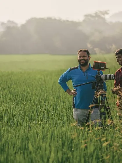 This is me in my happy place. Out in a field, setting up the camera for the perfect shot. Collaboration and having fun on set are a huge part of my process, whether it's with my team or with you.