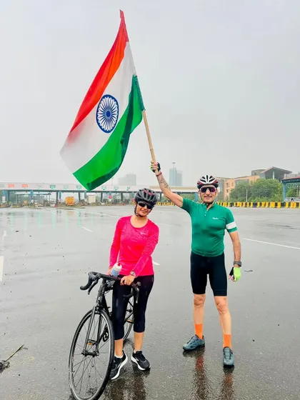 A couple from our group posing with the flag after the Independence Day ride.
