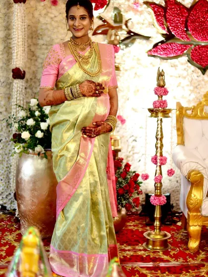 A full-length view of Savitha at her Sreemantham. The lightweight tissue silk drapes beautifully, ensuring comfort and elegance.
