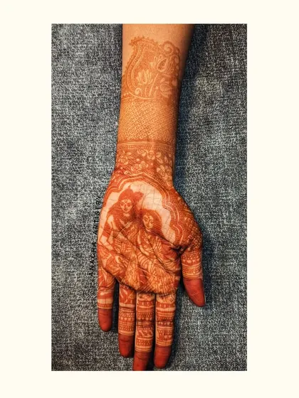 The final, mature stain of the Radha-Krishna portrait. The color has deepened to a beautiful dark brown, showcasing the quality of my organic henna.