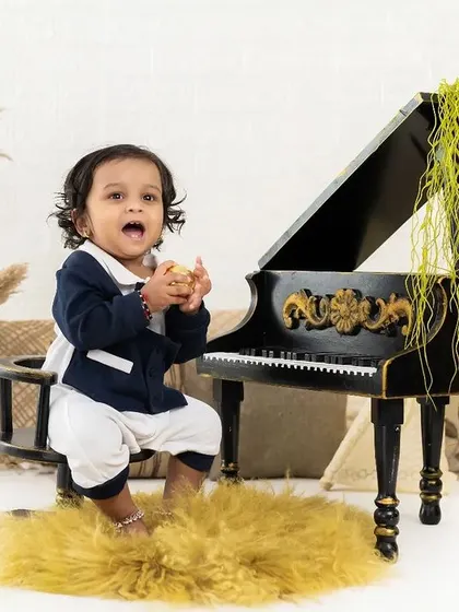 This little musician is full of expression. We capture the candid moments of exploration and play during our themed sessions.