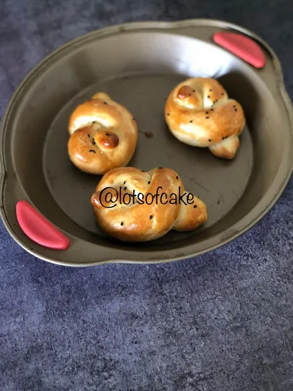 Look at these golden, soft dinner rolls, fresh from my oven in Cochin. I love shaping them into these little knots, and they are perfect for soaking up gravy or enjoying with a bit of butter.