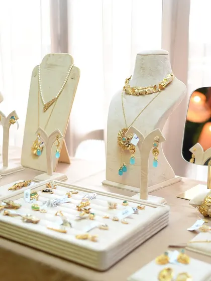 A beautiful display of our jewelry at the Aulerth X Kavana event. The collection features pieces with turquoise-hued stones, perfect for adding a pop of color.