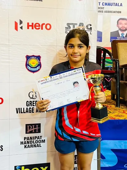 Here is our young champion, Prisha Agarwal, with her trophy and certificate after securing a bronze medal at the Haryana State Ranking Table Tennis Championship. Her performance demonstrates the competitive spirit we nurture.