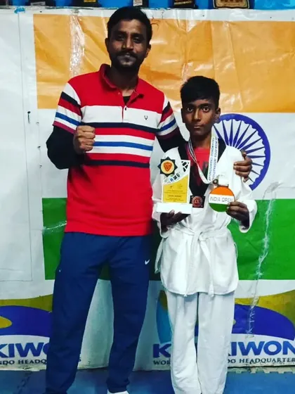 Congratulating my student on his win. A proud moment for both of us.