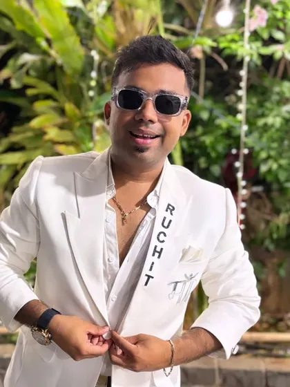 A smile for the camera. Feeling good and looking sharp in my custom white blazer, ready to create some magic.