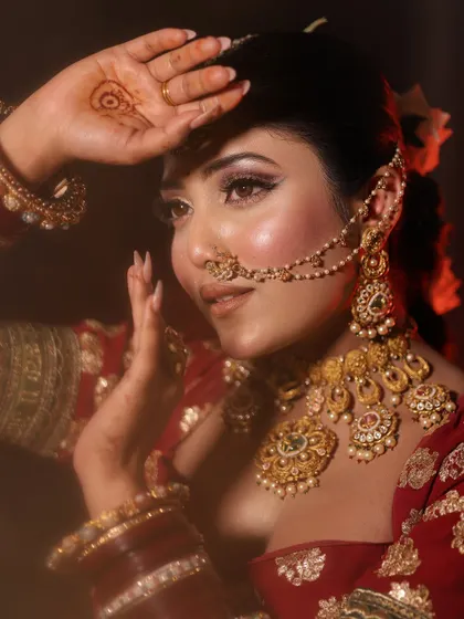 A classic pose, capturing the timeless beauty of an Indian bride.