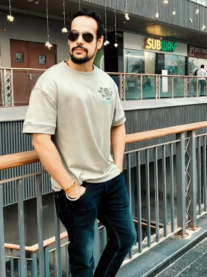 A confident pose during a day out. The aura you build in the gym extends to all parts of your life.