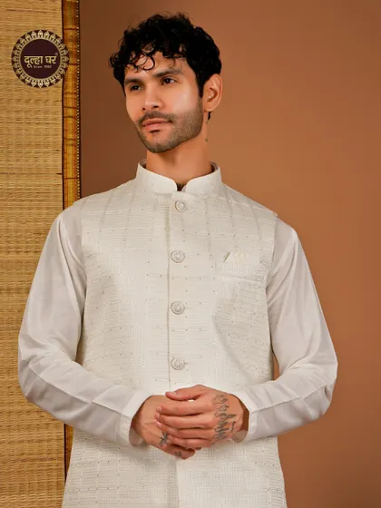 Effortless elegance in every thread. An off-white textured Nehru jacket paired with a matching kurta, a classic and versatile choice.