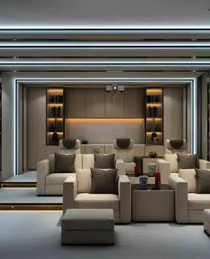 For the ultimate entertainment experience, we design dedicated home theater rooms. This space features tiered seating with comfortable recliners, acoustic wall paneling, and professional-grade projector and lighting systems.