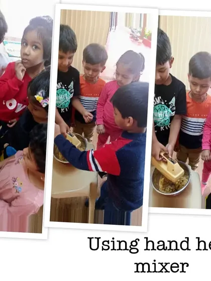 Taking turns with a hand-held mixer to combine the cookie dough ingredients. This activity introduces children to simple kitchen tools and the concept of mixing.