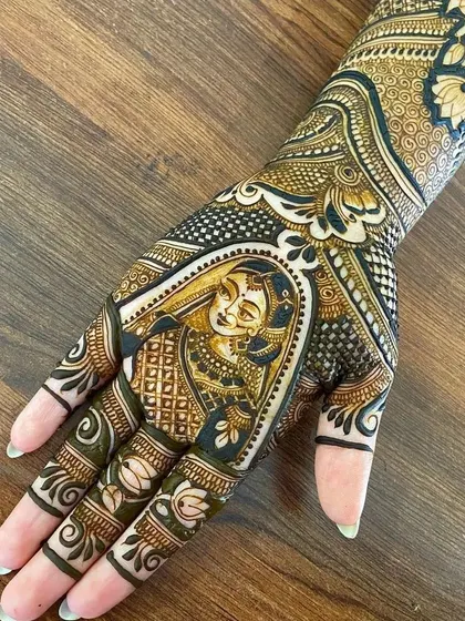 A beautifully detailed portrait of a bride in her wedding attire, drawn on the back of the hand. The use of negative space and shading makes the portrait stand out.