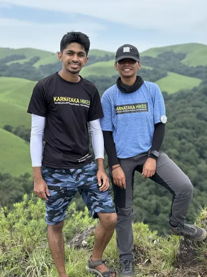 Two of our trek leads posing on the beautiful green slopes of Bandaje.