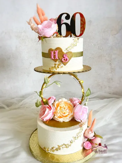 A stunning 60th wedding anniversary cake. I was so honored to create this two-tier floral spacer cake to celebrate such an incredible milestone of love.