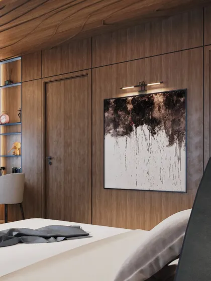 On the opposite wall, wood paneling adds warmth and texture. A large piece of abstract art is highlighted by a picture light, creating a focal point.