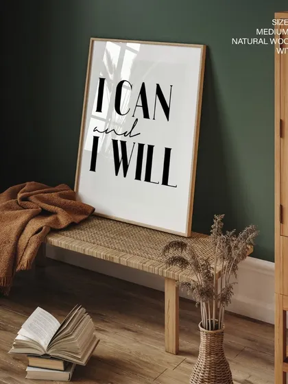 Another view of the "I CAN and I WILL" print, demonstrating its versatility in a modern space. The natural wood frame complements the rustic bench and decor.