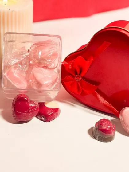 A collection of my heart shaped chocolates for Valentine's Day. These handmade chocolates come in different shapes and fillings, available in small gift boxes or as part of a larger assortment.