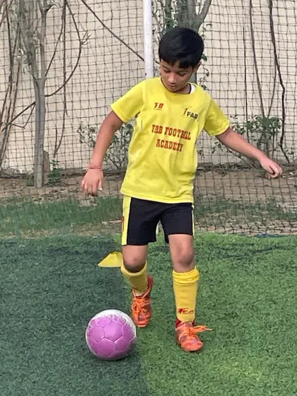 A player practicing his dribbling. Our 1-on-1 training focuses on each child's unique needs and potential.