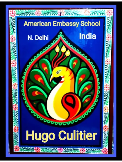 A personalized sign for a client at the American Embassy School, featuring a peacock motif painted in a traditional Indian style, framed with colorful patterns.