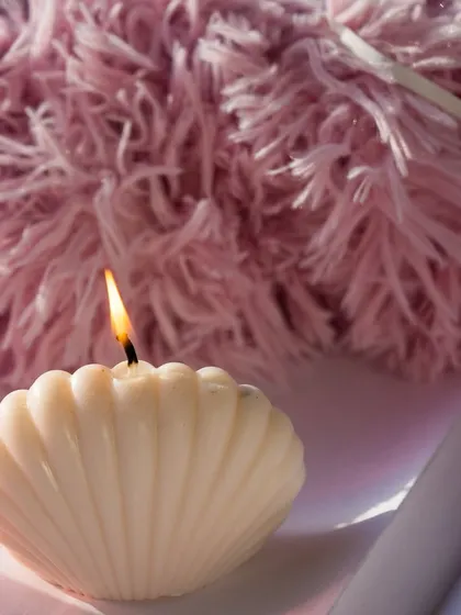 Happy weekend. Enjoying the gentle glow of our oyster shell candle.