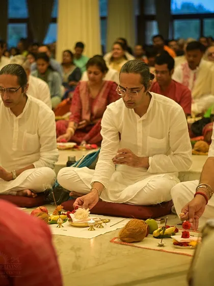 Participants perform the Guru Puja, making offerings of flowers. This simple act, when done with awareness and gratitude, becomes a profound spiritual practice.