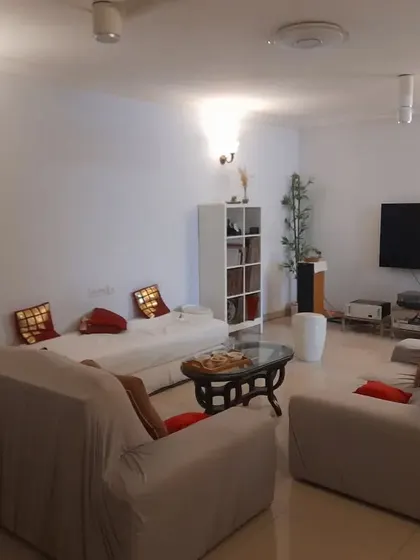 **BEFORE:** This living room was functional but lacked personality. The furniture arrangement and lack of focal points made it feel generic and uninspired.