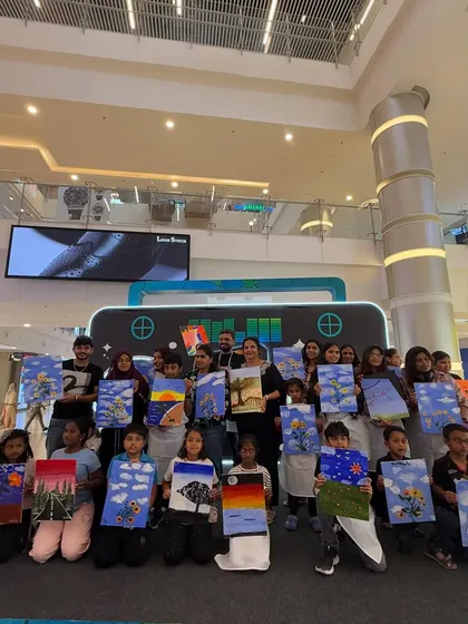 The final group shot from our pop-up painting event in a mall. So many happy faces and unique masterpieces created in just two hours.