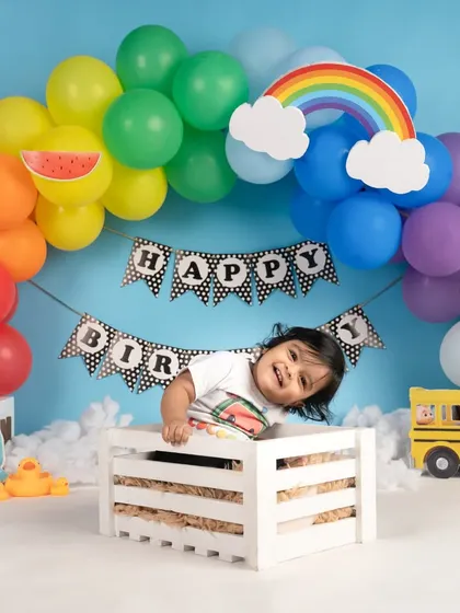 A playful, tilted pose that perfectly captures the fun-loving energy of a one-year-old.