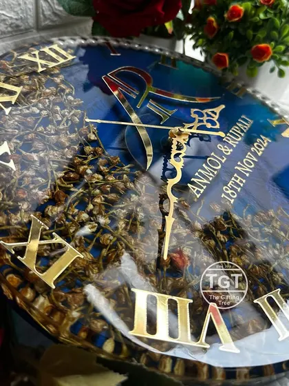 A close-up look at the intricate details, including the custom couple logo and the delicate hands of the clock. The high-gloss resin finish protects and magnifies every element.