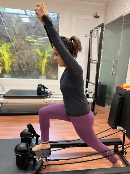 Various shots of members and instructors in action during our dynamic Reformer Pilates classes.