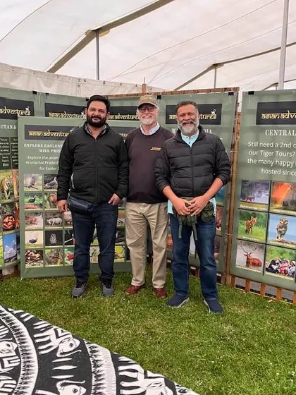 Our team stands in front of our tour displays at the Global Birdfair. From Central India's tigers to the birds of the Himalayas, we offer expertly guided tours across the subcontinent.