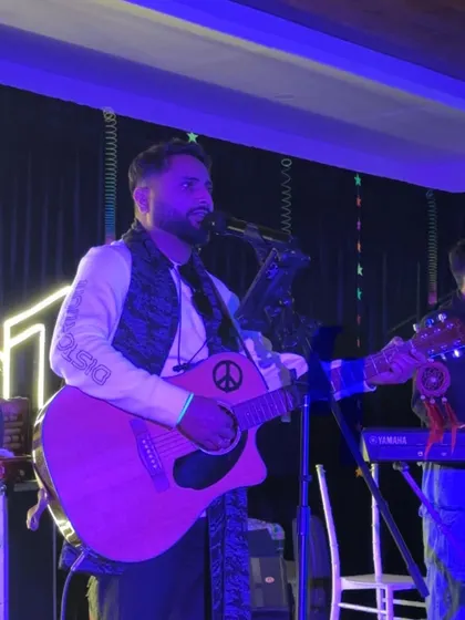 A close-up shot during our New Year's Eve gig. You can see the energy and passion I bring to every performance, especially with the full band backing me up.