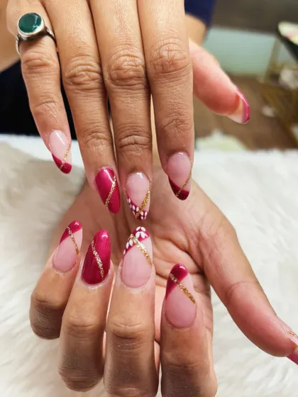 A final look at the elegant red, gold, and white festive nail art, perfect for any holiday celebration.