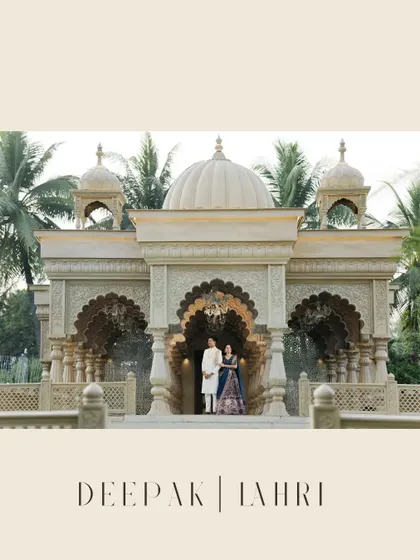 A grand pre-wedding portrait in front of a beautiful, temple-like structure, showcasing a blend of architectural beauty and romantic elegance.
