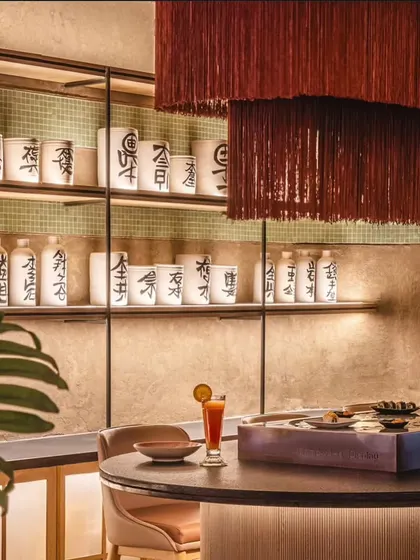 We added an authentic touch to this Japanese restaurant by hand-painting sake-style calligraphy onto these ceramic pots. The characters add to the restaurant's theme and create a sophisticated visual focus behind the bar.