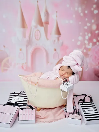 The full fairytale spa setup, with a castle backdrop and designer shopping bags. It's a perfect blend of glamour and sweetness.