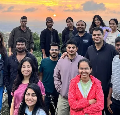 The group at the Anthargange viewpoint, just as the sun begins to rise, casting a golden glow on the landscape.